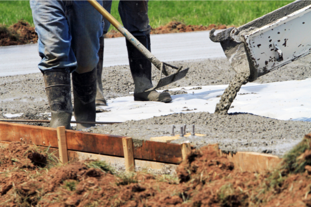 Concrete Driveway Workers Pouring Concrete