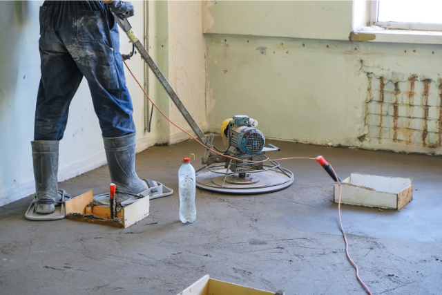 Worker performing concrete repair