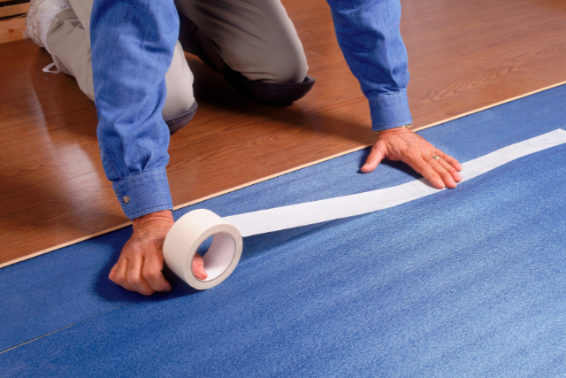 Workman Repairing Flooring